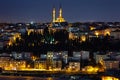 Night view of the illuminated city, the illuminated houses and the mosque. Lights are on in the windows. Royalty Free Stock Photo